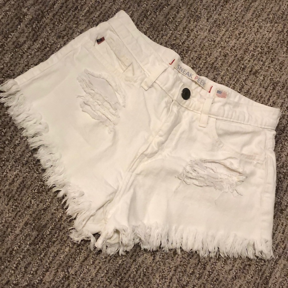 Distressed white denim shorts